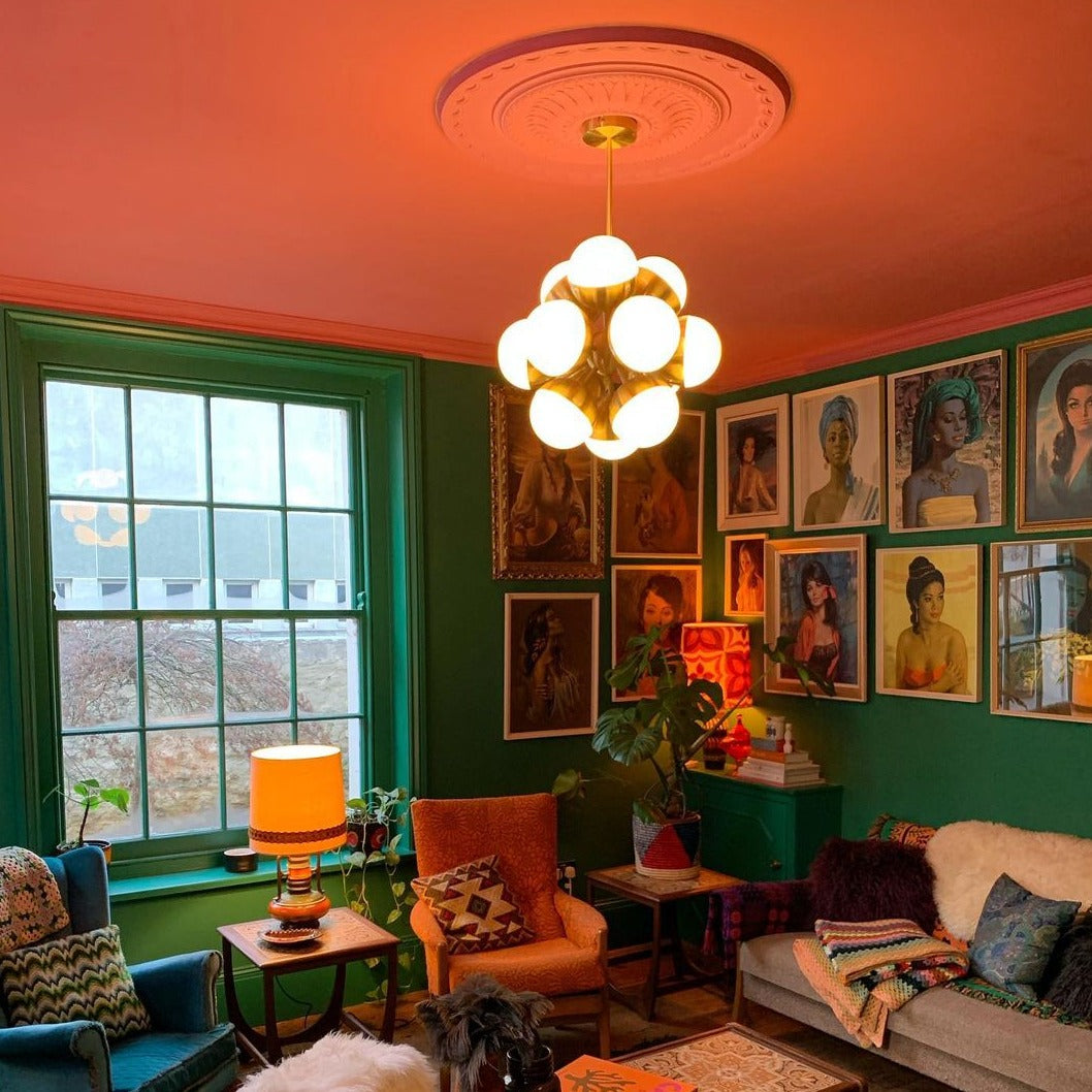 victorian ceiling rose painted pink in green room
