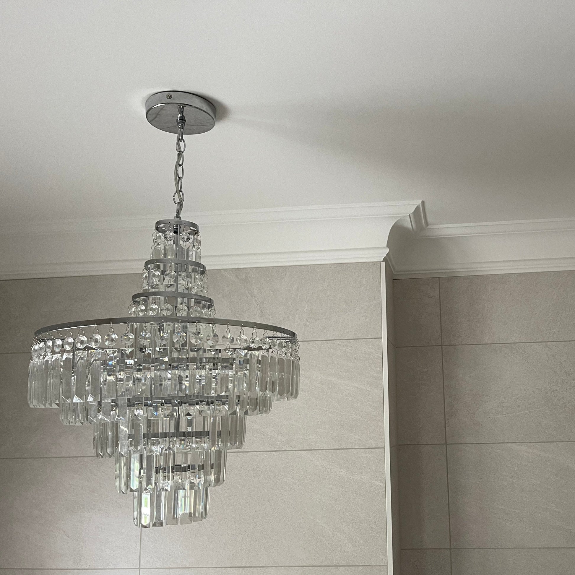 plaster coving swan neck mitre shown with chandelier