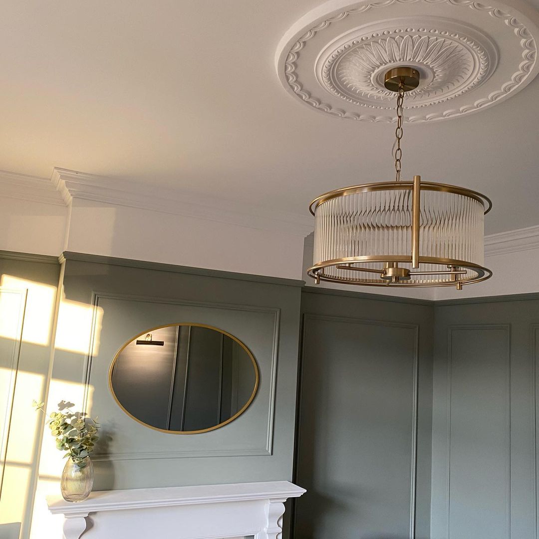 large victorian ceiling rose fitted in green paneled room