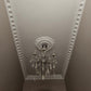 dentil plaster coving shown with ceiling rose and chandelier 