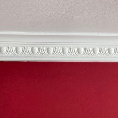 close up section of egg and dart plaster cornice