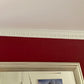 small egg and dart plaster coving shown in red room