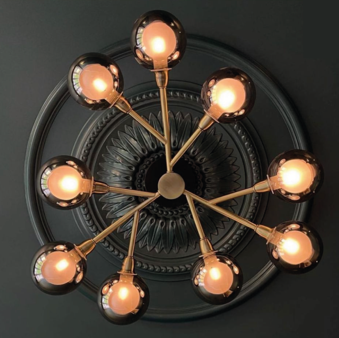 Large plaster sunflower ceiling rose in gothic room