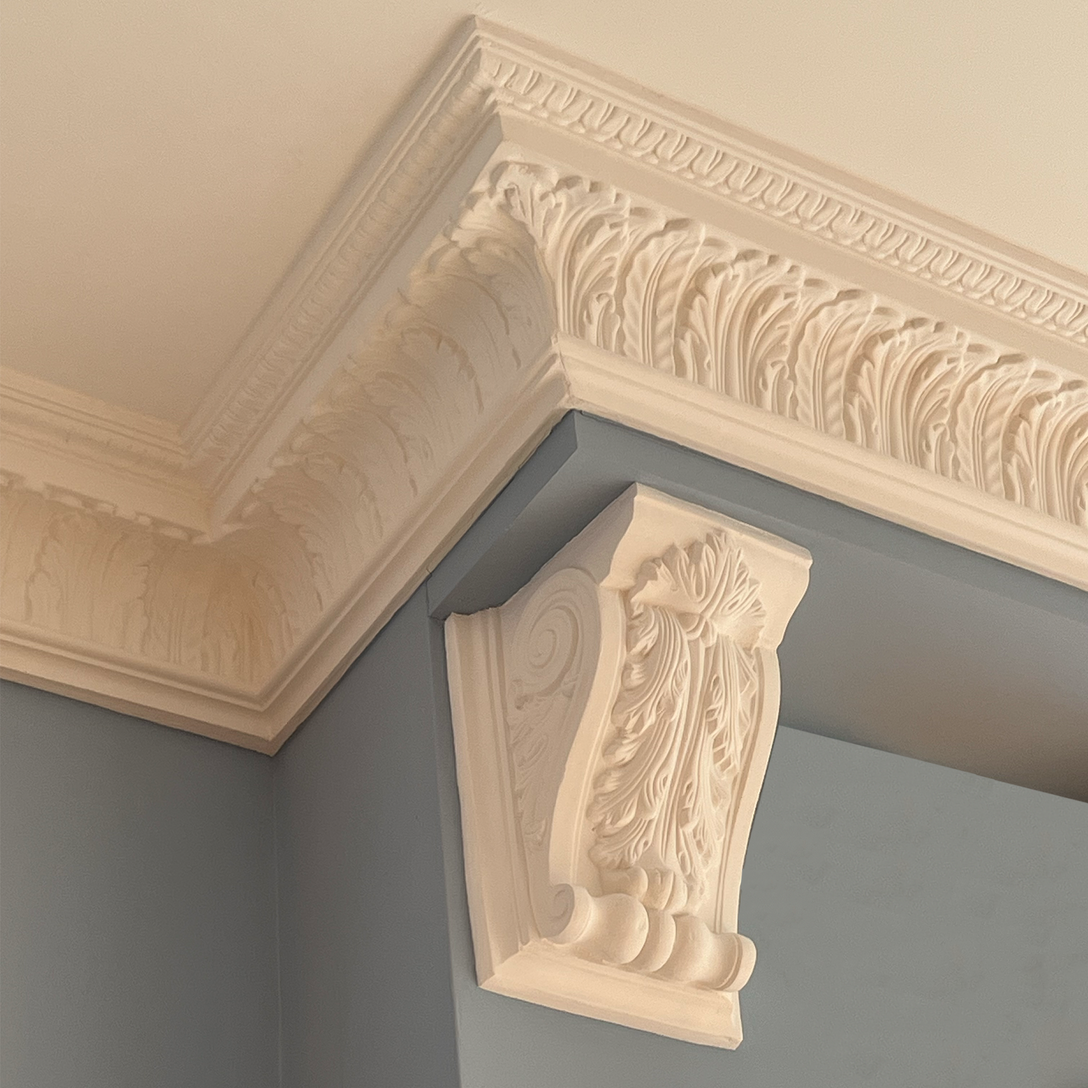 Victorian floral corbel in bright blue room