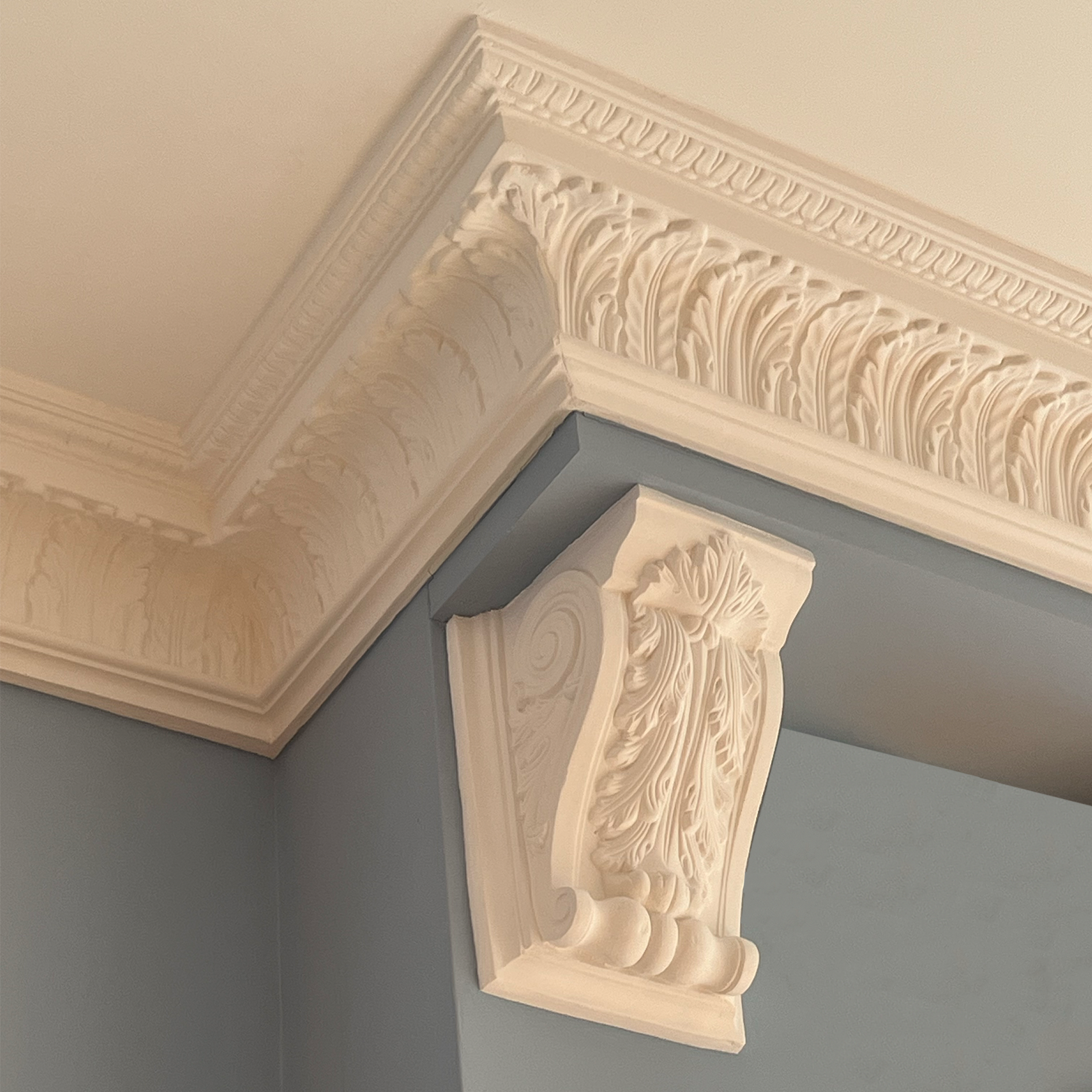 Victorian floral corbel in bright blue room