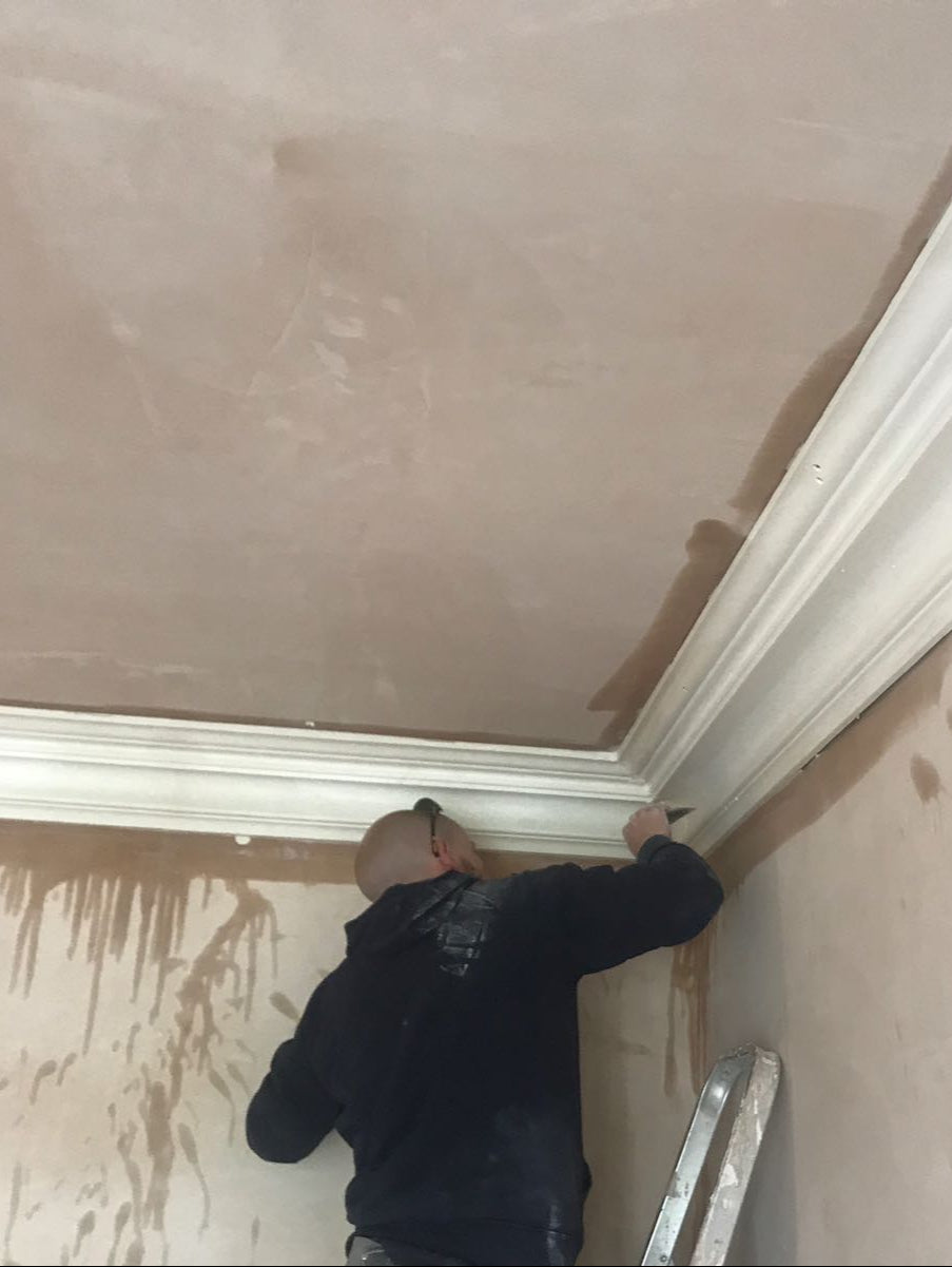 swan neck coving being fitted
