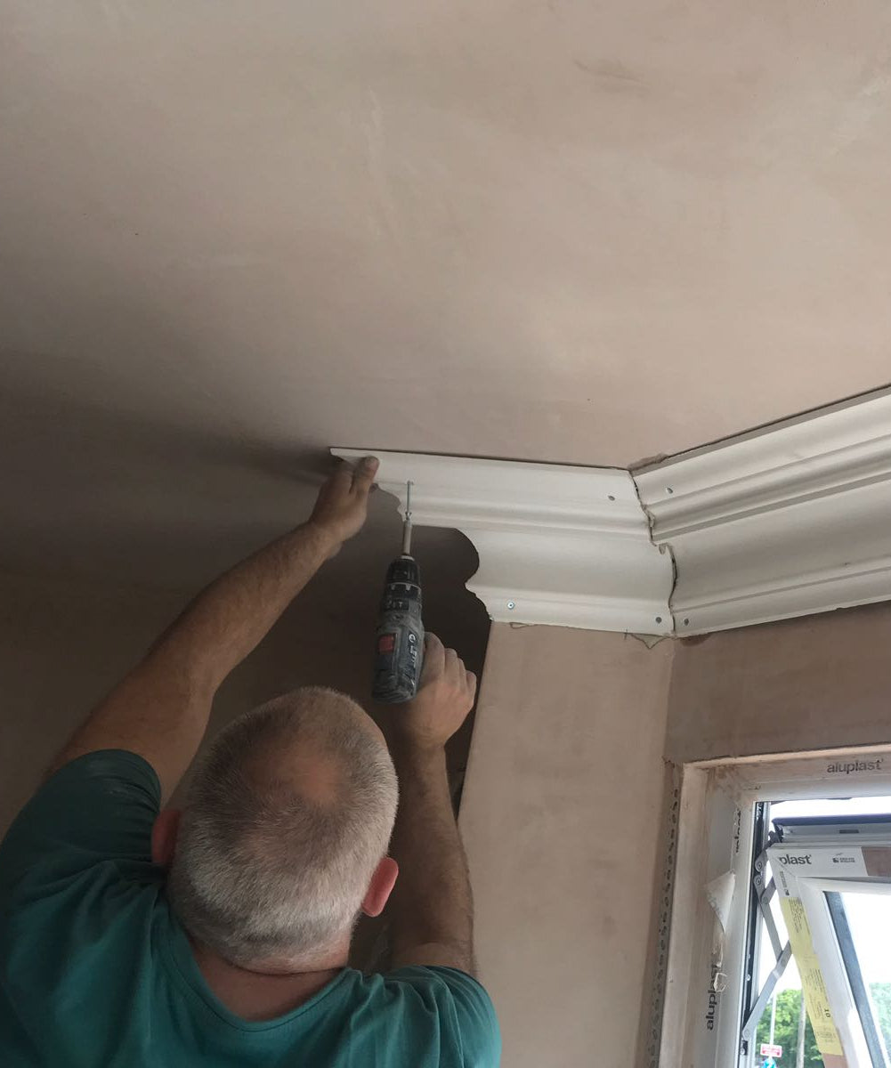 swan neck plaster coving being fitted