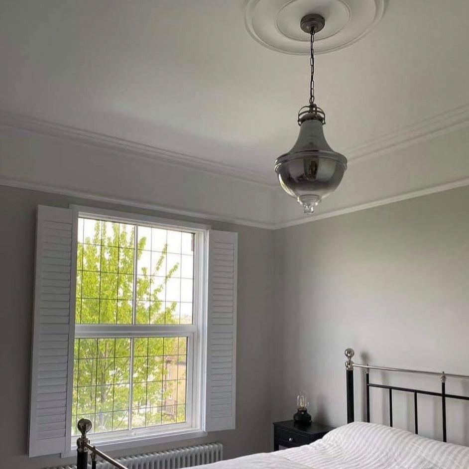 Plain Spun Plaster Ceiling Rose in bedroom