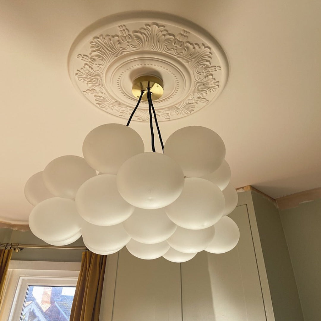 victorian plaster ceiling rose shown with glass bubble chandelier