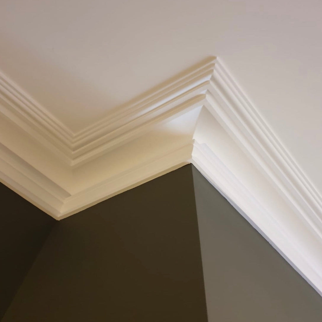 image showing corner sections of fitted swan neck plaster cornice