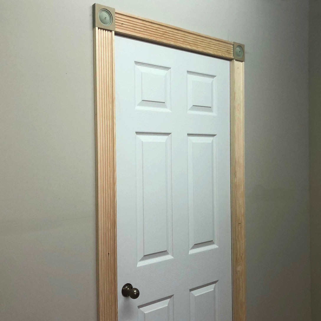 photo of fluted Victorian Timber Architrave fitted around a door - 91mm x 20mm