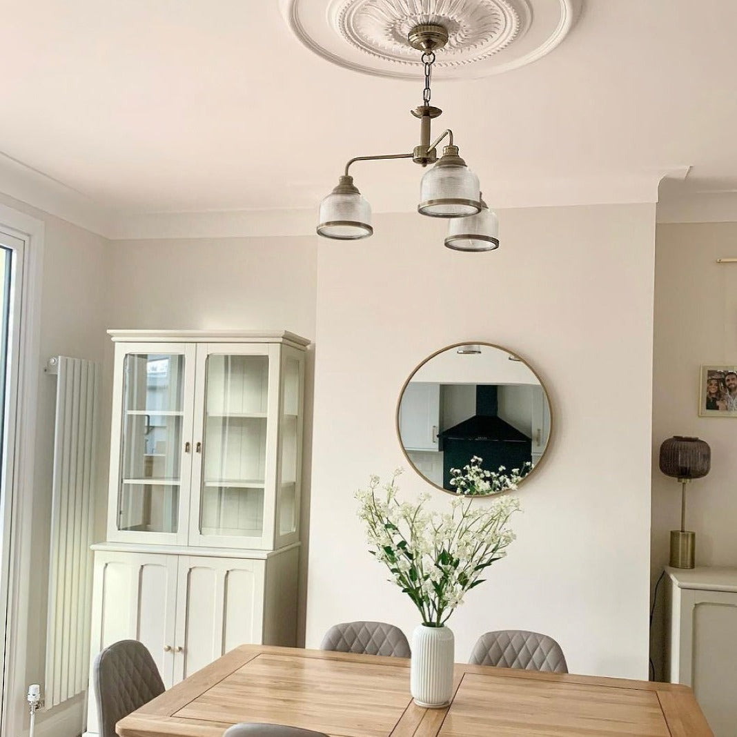 Large Sunflower Ceiling Rose in well-lit dining room