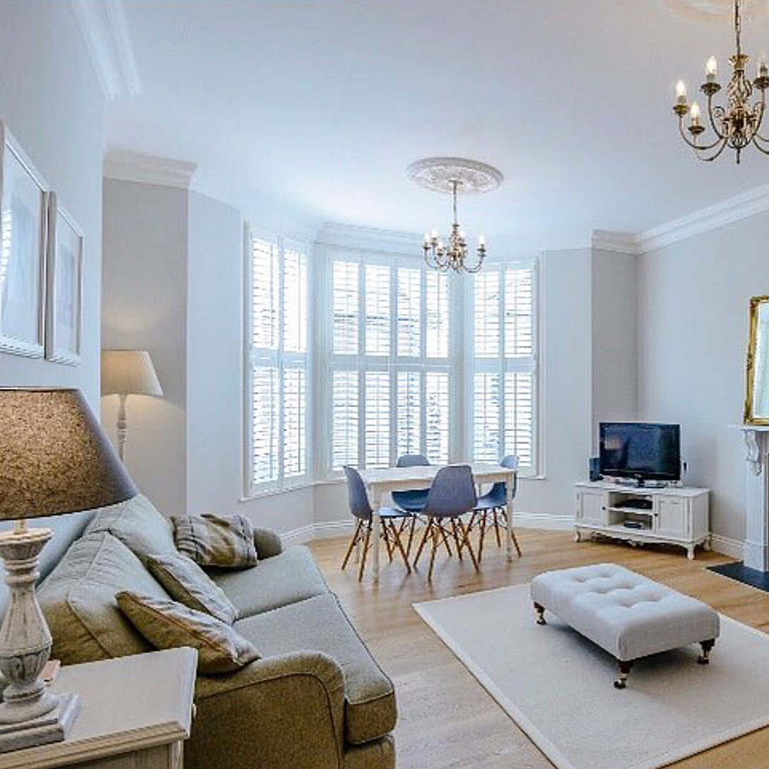 Swan Neck Plaster Coving shown in high ceiling open living room125mm