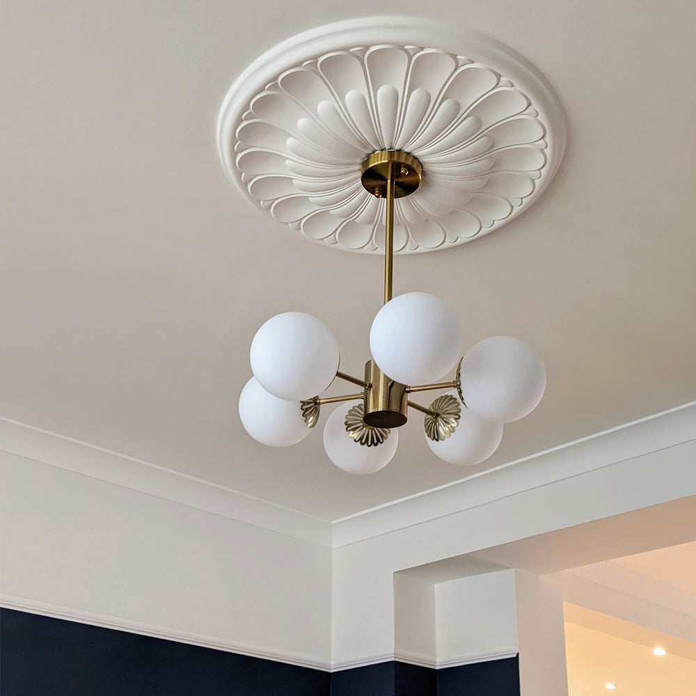 floral plaster ceiling rose shown fitted with art deco chandelier