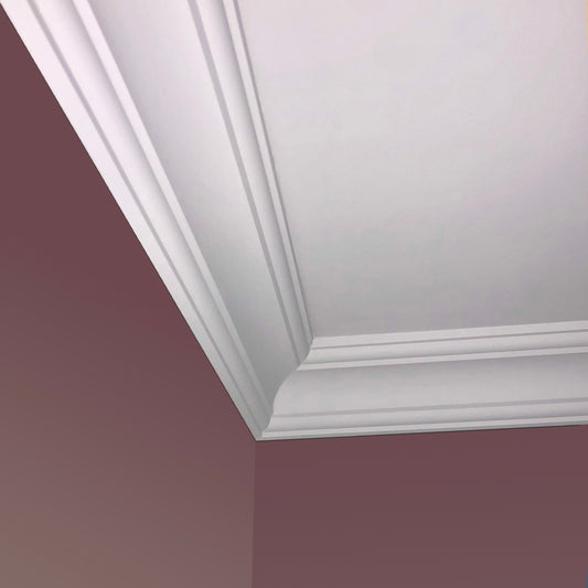 corner of Classic elegant Plaster Coving shown on a pink wall - 85MM 
