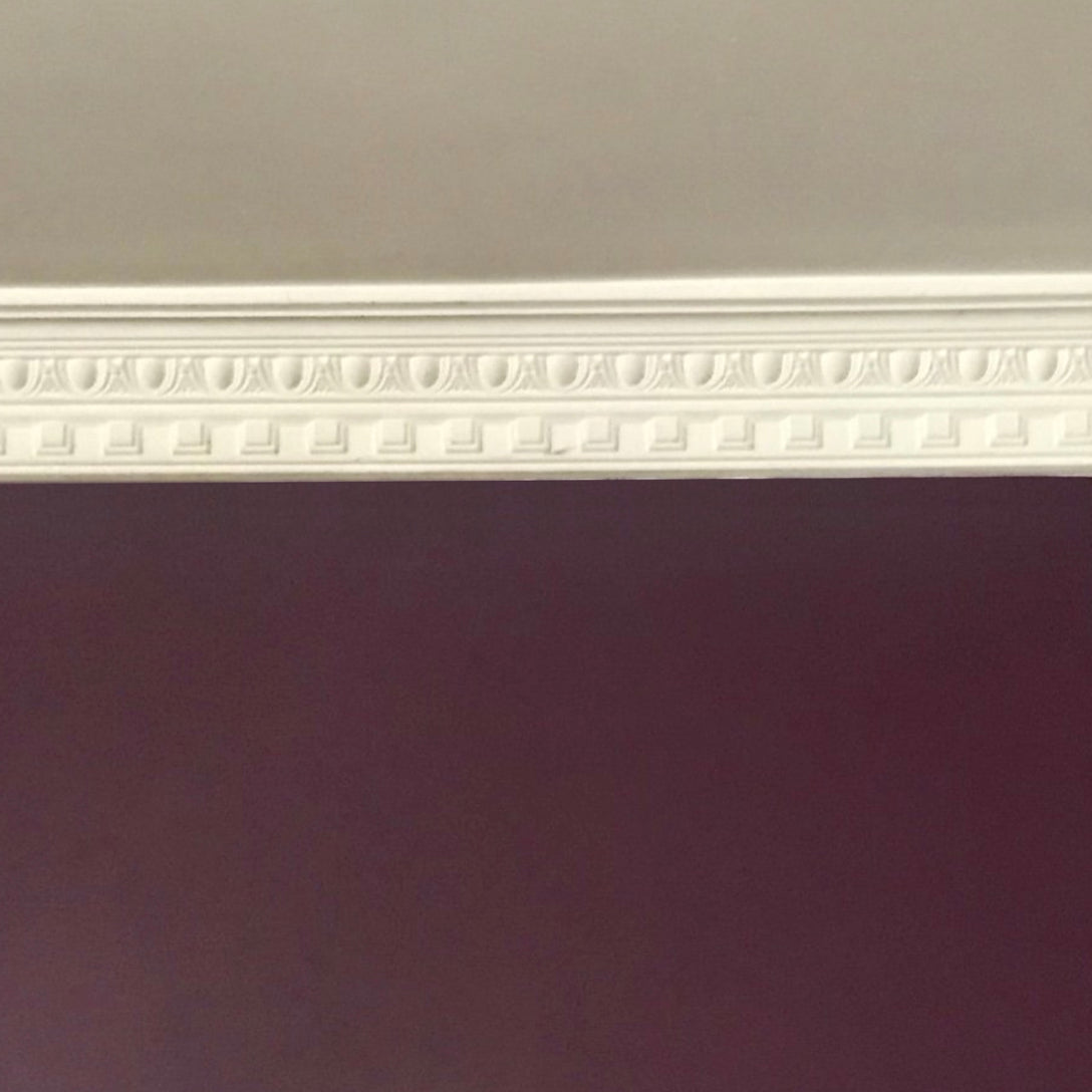 Dentil Egg & Dart cornice on maroon wall