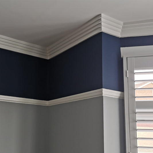 image of Art Deco Four Step plaster coving in a blue living room - 100mm