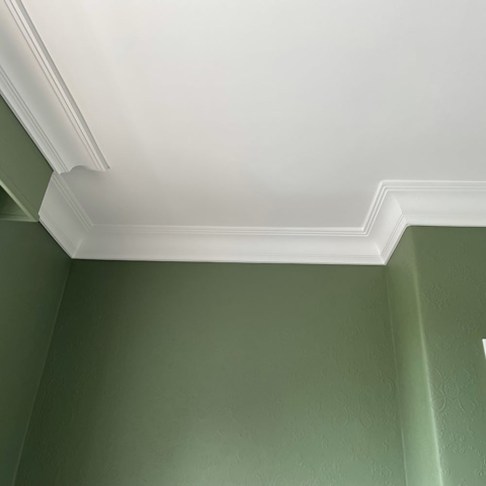 Regency Cove cornice against green wall