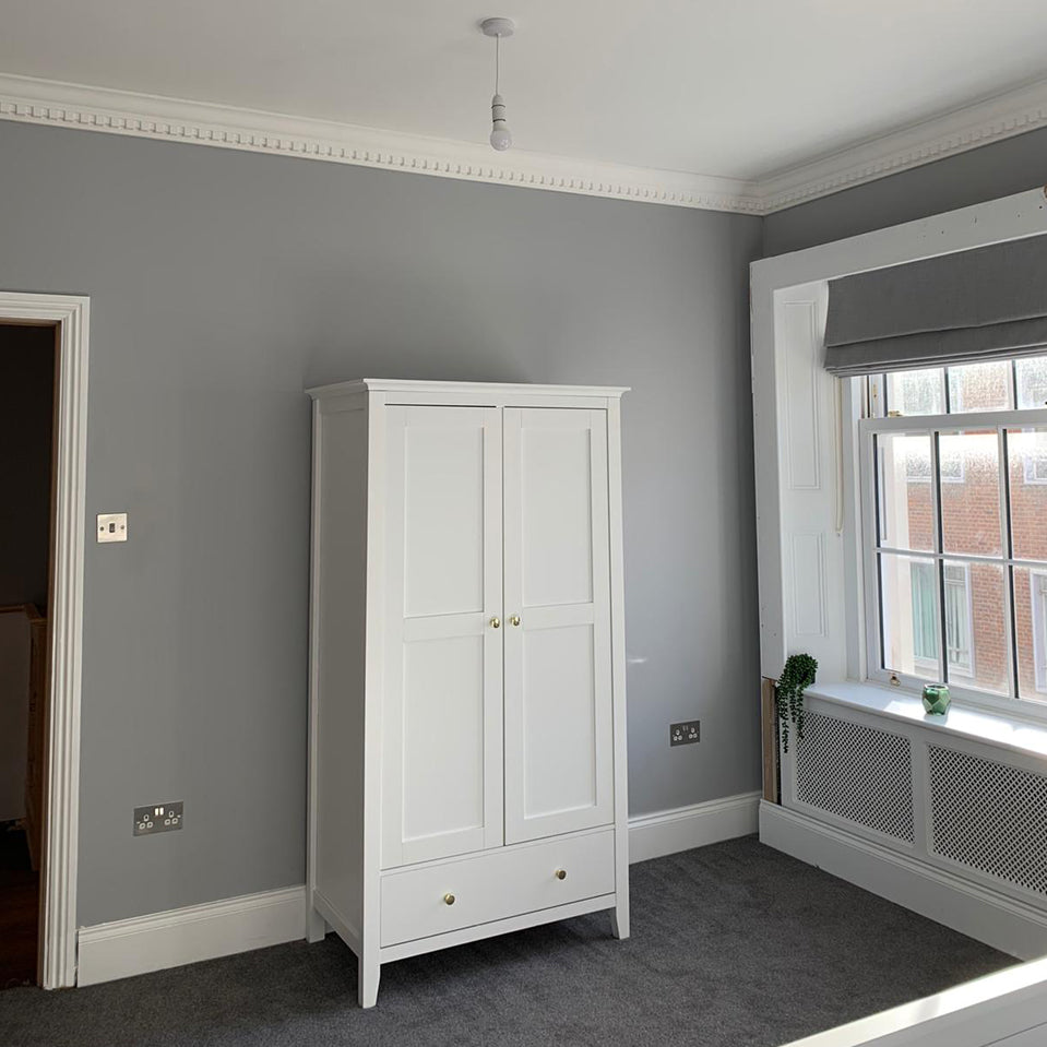 Dentil coving in naturally lit bedroom