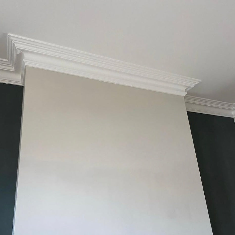 swan neck plaster cornice shown fitted around a chimney breast 