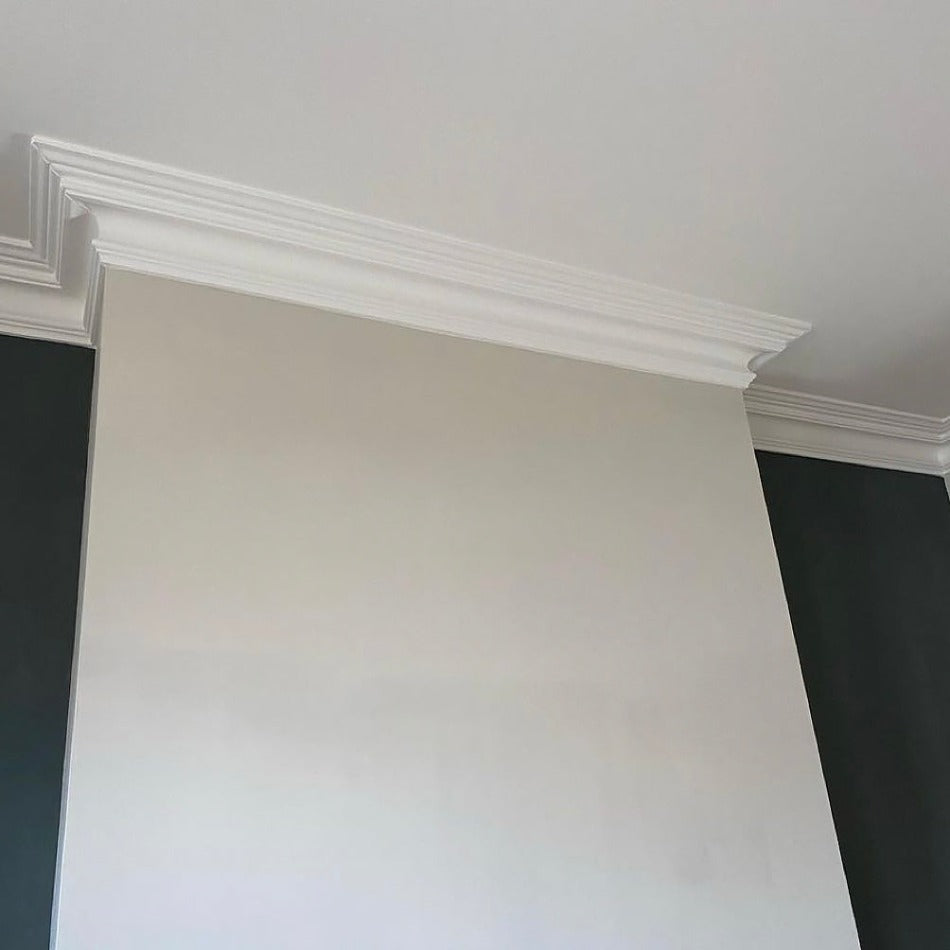 swan neck plaster cornice shown fitted around a chimney breast