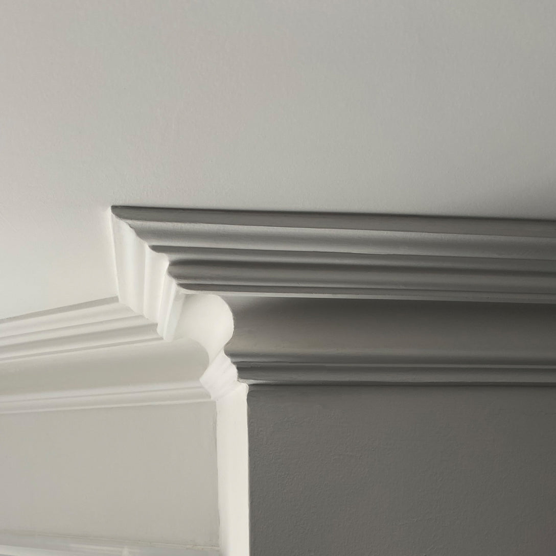 close up photo showing swan neck Plaster Coving section 100mm