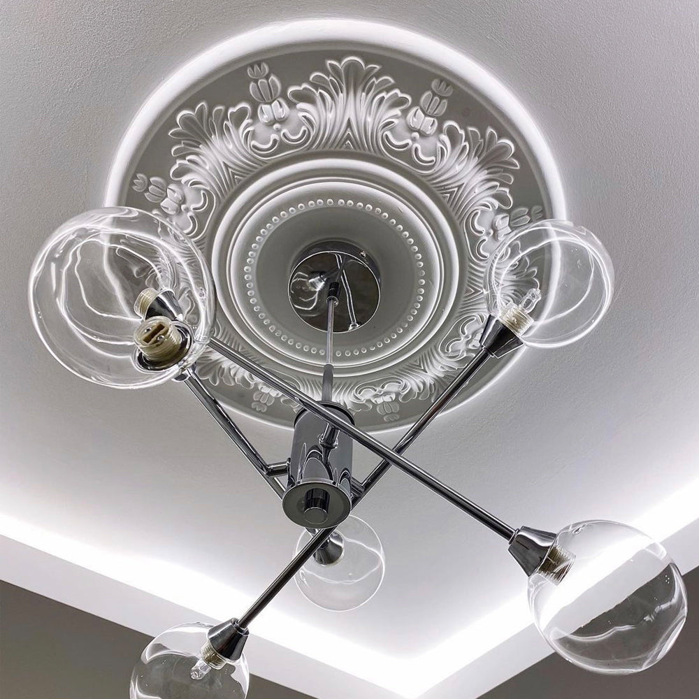 photo of victorian style plaster ceiling rose fitted with art deco chandelier
