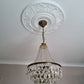 example of victorian plaster ceiling rose fitted with glass chandelier 