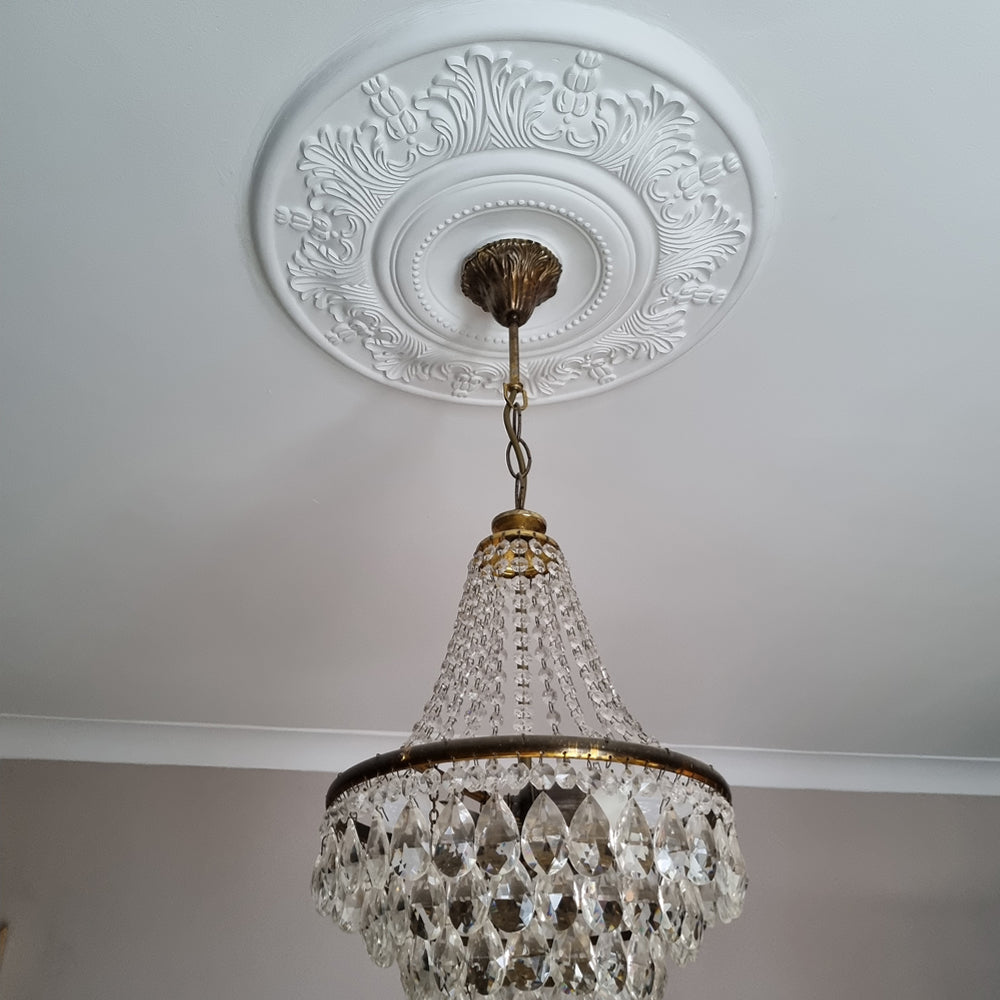 example of victorian plaster ceiling rose fitted with glass chandelier