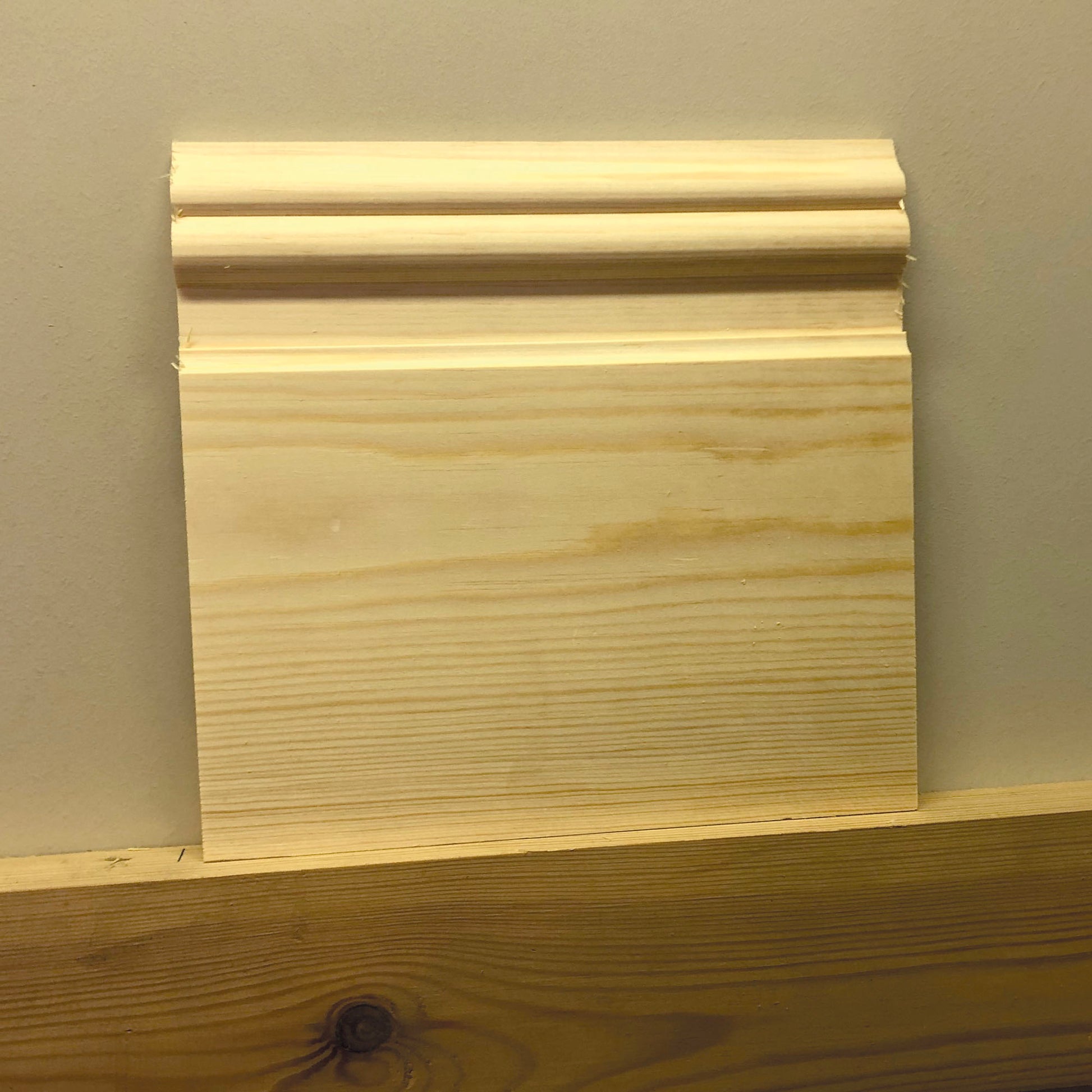 small cut-off section of Nine Inch timber Skirting Board 215mm x 21mm