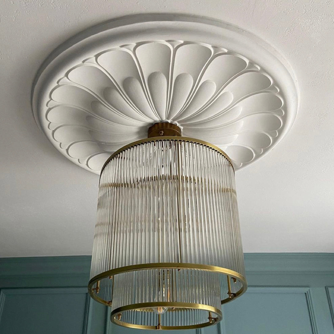 floral art deco plaster ceiling rose shown with tiered chandelier 680mm