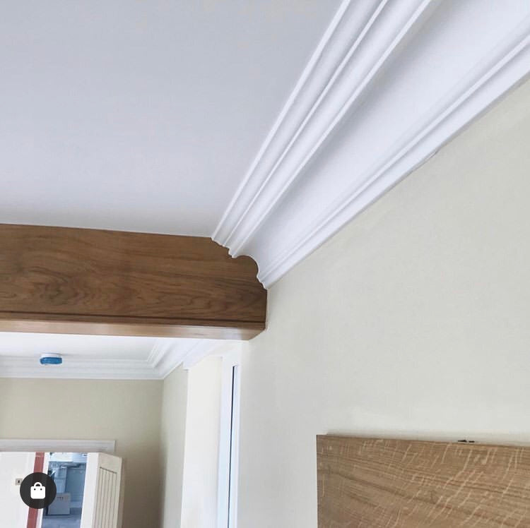 Swan Neck Plaster Coving shown joining with roof beam 125mm