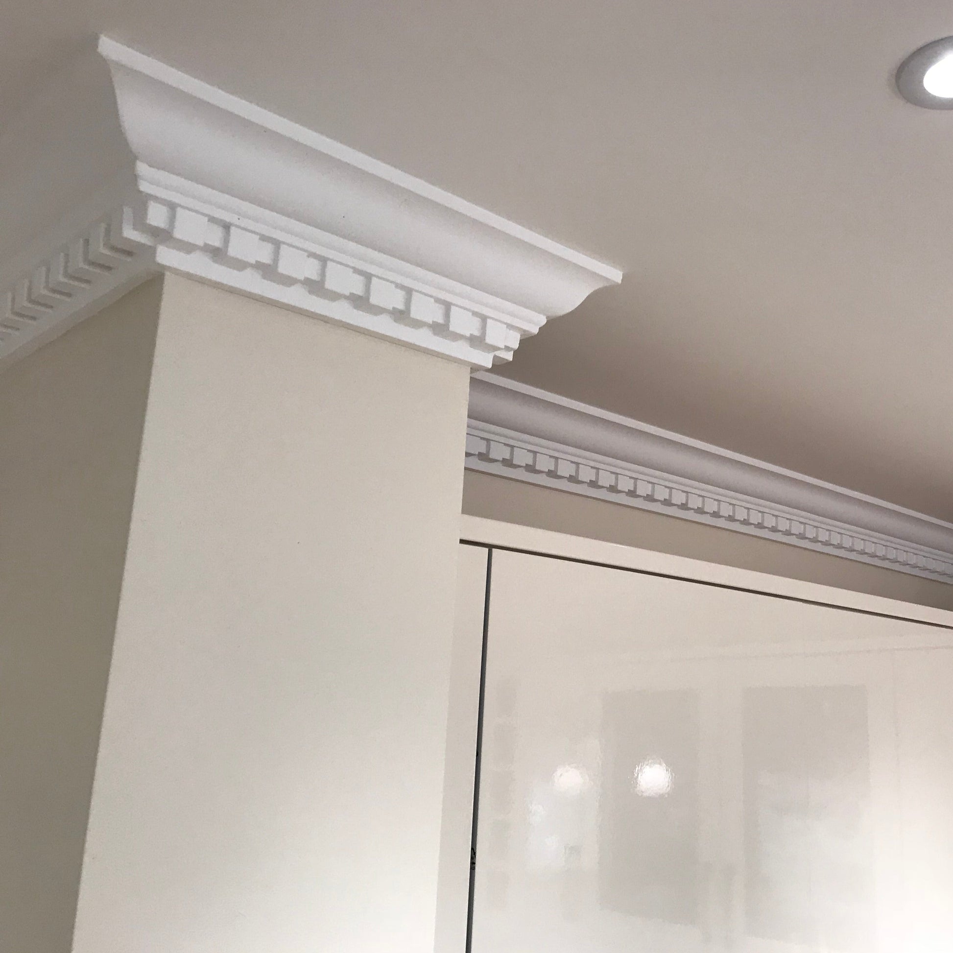 Dentil coving in well-lit kitchen