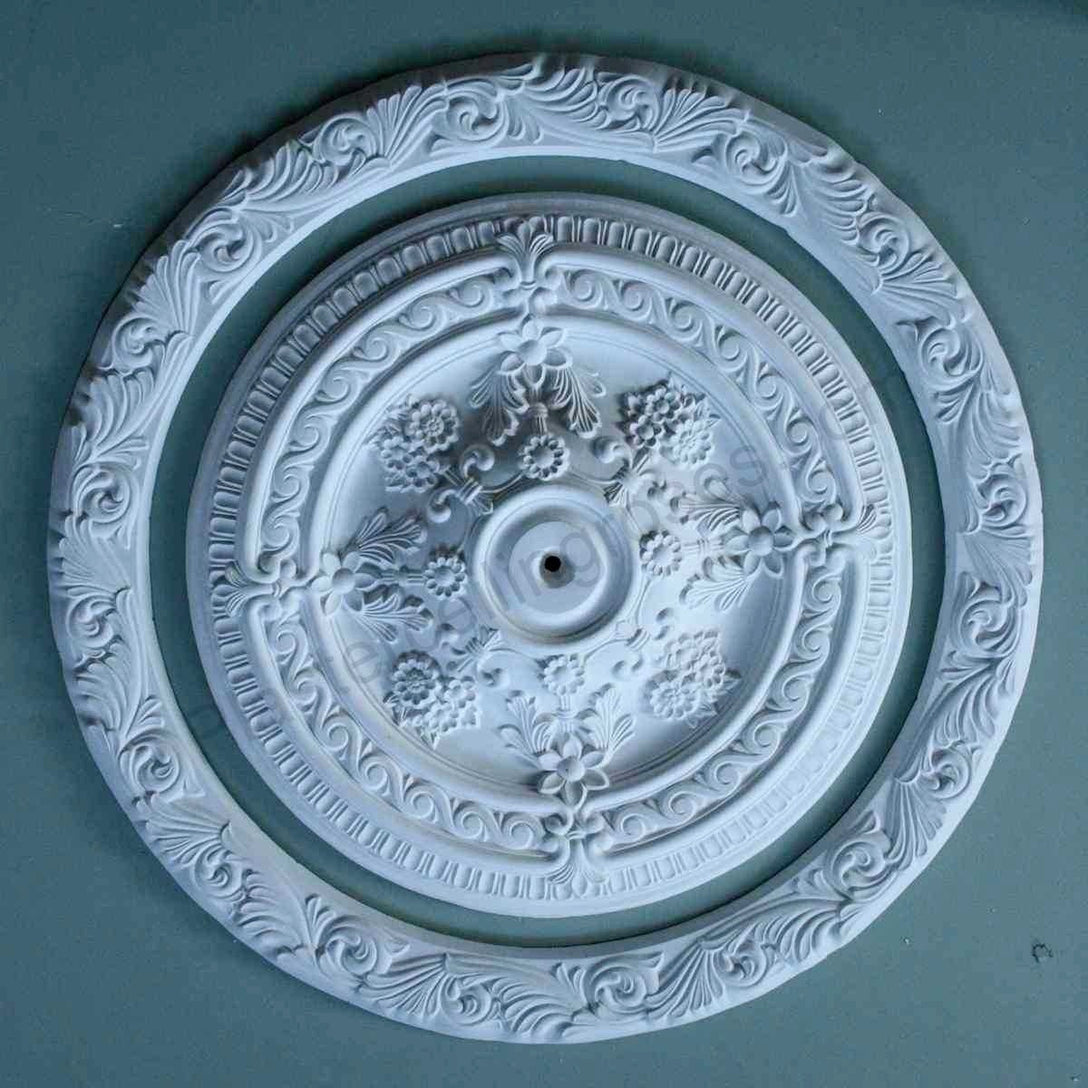 Large Plaster Ring Ceiling Rose against dark ceiling