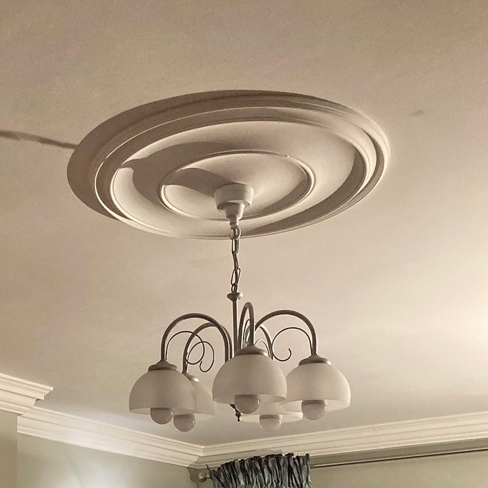 Plain Spun Plaster Ceiling Rose in warm tone lighting