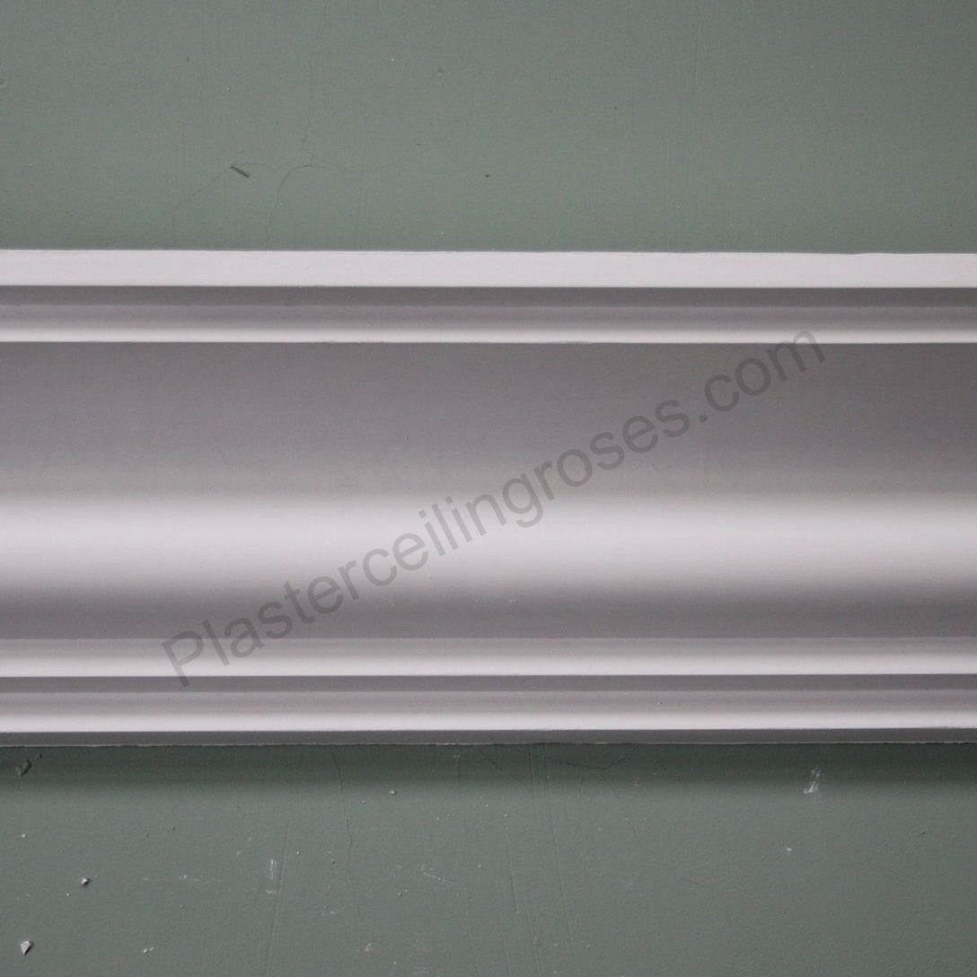 Ogee coving detail against sage wall