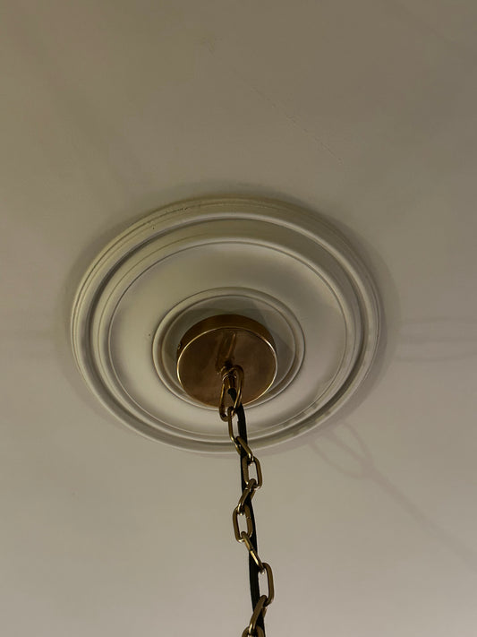 Close up fitted victorian plain spun ceiling rose