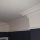 close up of victorian swan neck coving in navy room