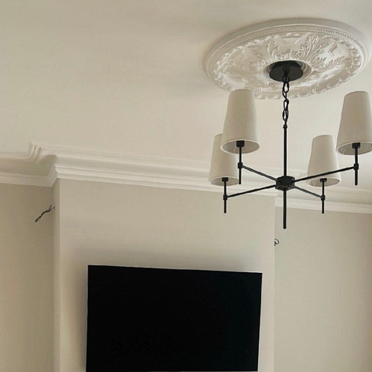 swan neck plaster coving and floral ceiling rose fitted in living room