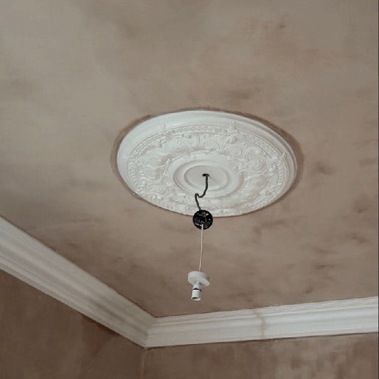 Victorian plaster ceiling rose during instillation 