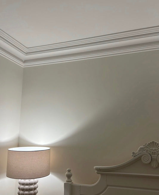 large swan neck cornice fitted in bedroom