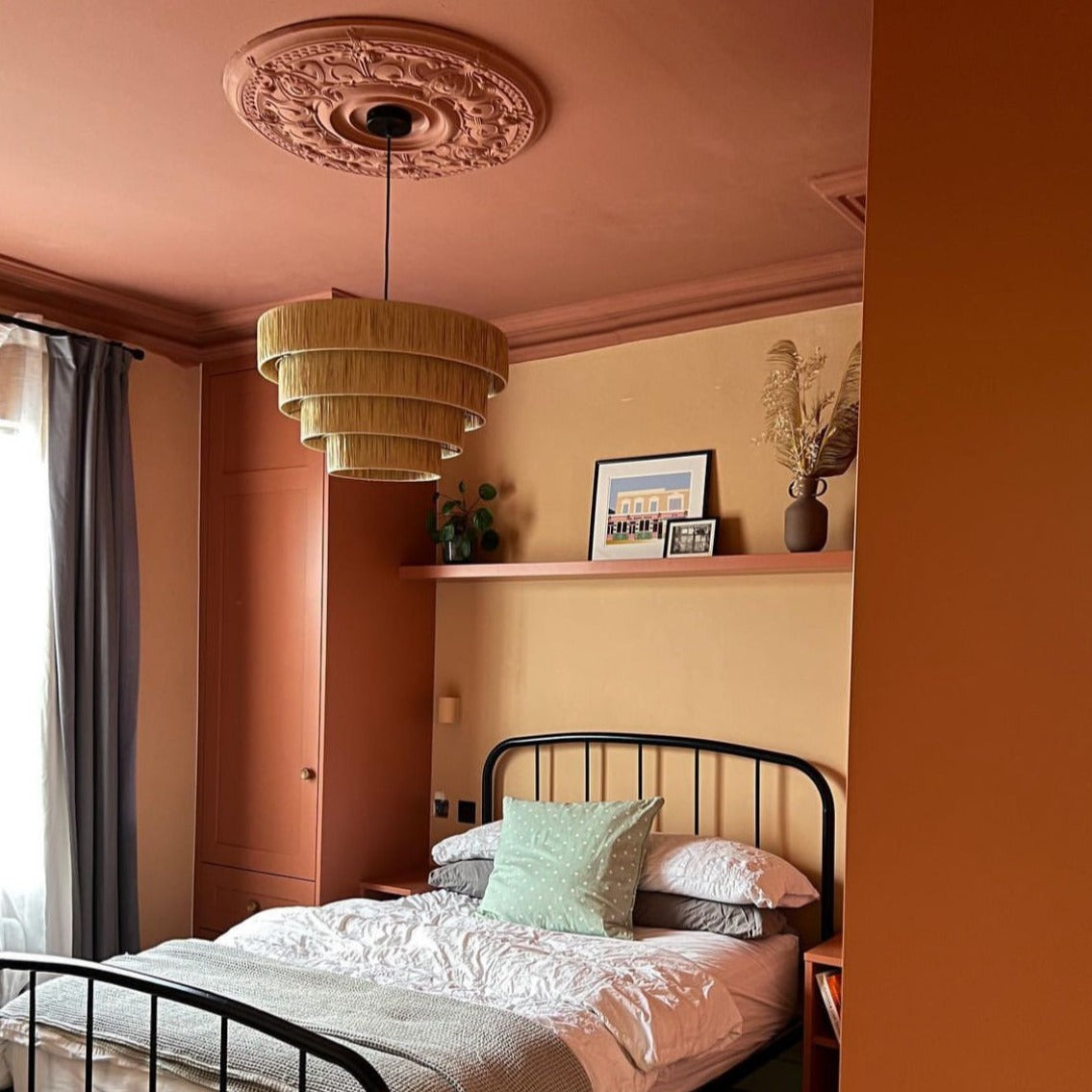 ornate large plaster ceiling rose in bright colourful room