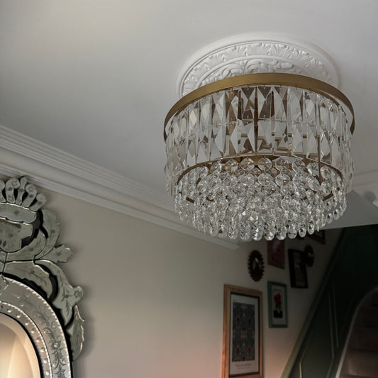 small ornate plaster ceiling rose fitted in stairway 