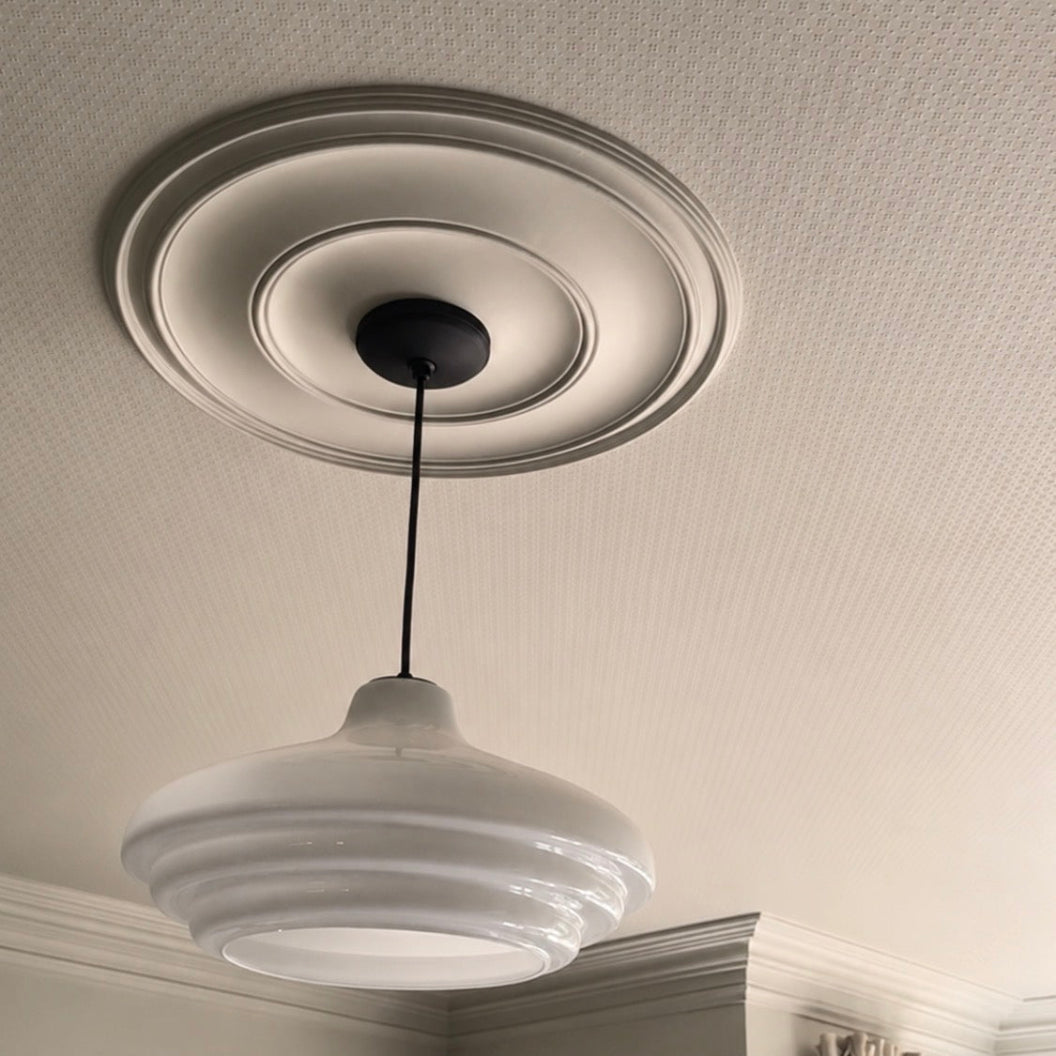 Example of Installed medium plain spun plaster ceiling rose. 