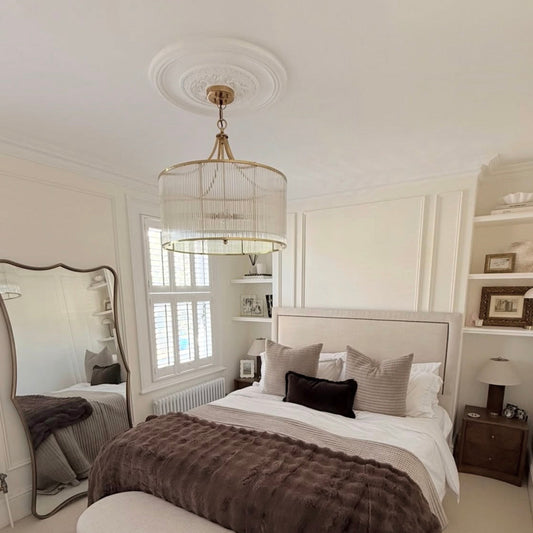 Victorian swan neck plaster cornice and ceiling rose fitted in cozy bedroom