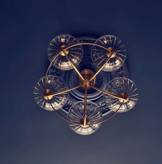 ornate plaster ceiling rose with light fitting