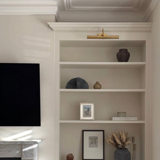 victorian swan neck plaster coving fitted above shelves