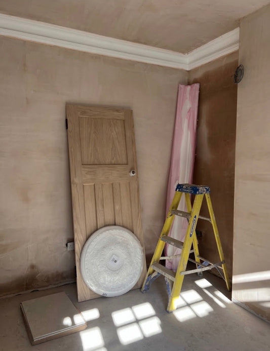 room before plaster cornice and rose instillation 