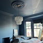 victorian ornate plaster ceiling rose in dark bedroom