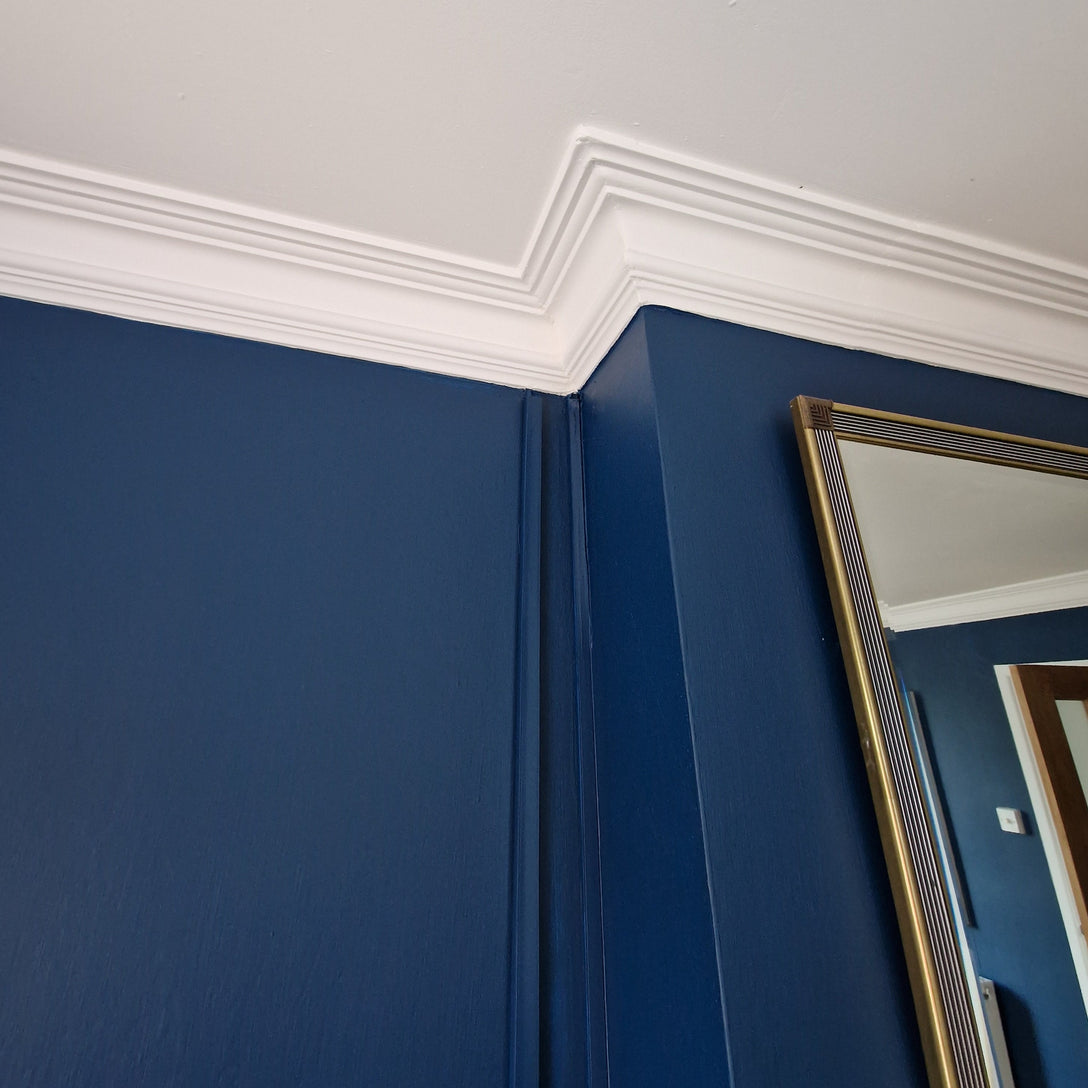 victorian swan neck plaster coving shown in blue room